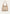 Cremebeige Damen-Handtasche aus Leder in frontaler Freistellung mit breitem Tragegriff.
