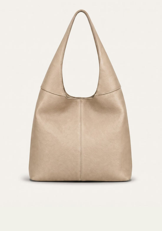 Cremebeige Damen-Handtasche aus Leder in frontaler Freistellung mit breitem Tragegriff.