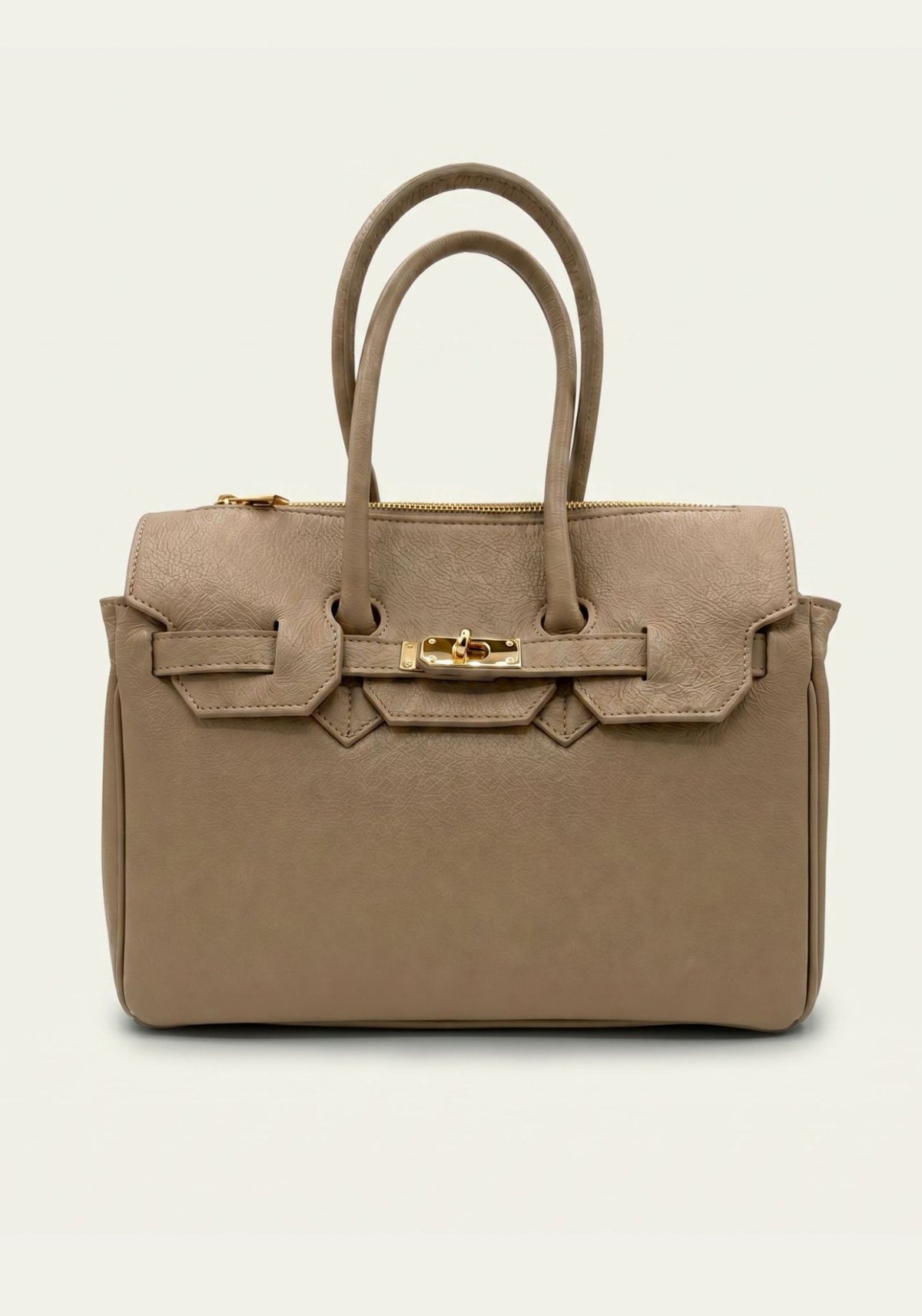 Taupefarbene Damen-Handtasche aus Leder in Frontansicht mit zwei Henkeln.