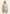 Curly Lammfelljacke für Damen in Creme-Beige, am Modell von vorne mit weitem Kragen und geradem Schnitt.
