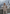 Laure Lammfelljacke Beige, Lifestyle-Aufnahme in Berglandschaft mit Seepanorama
